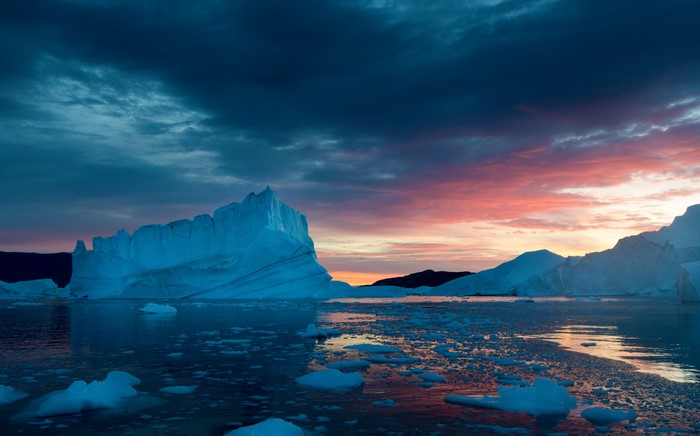 Icebergs in Arctic Atlantic Oceans at Sunset