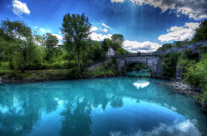 Bridge over a turquoise river in Slovenia