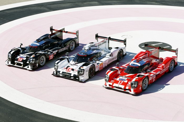 Three Porsche 919 Hybrid race cars on track