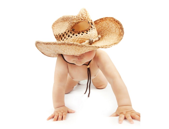 Baby wearing a cowboy hat