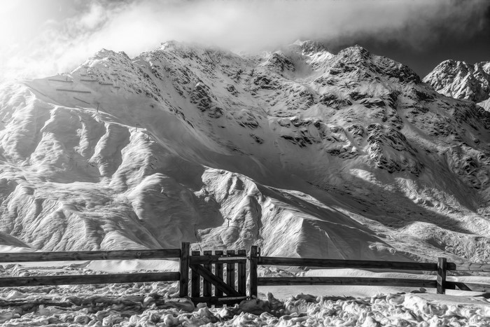 Winter Gate and Snow-Covered Mountains