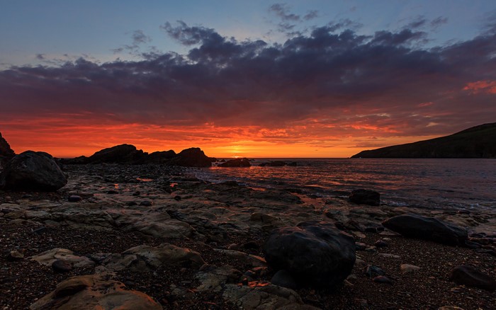Sunset over rocky coast at Porth Swtan-Church Bay Anglesey