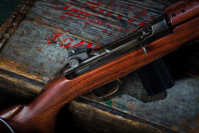 M1 Carbine rifle on a wooden crate