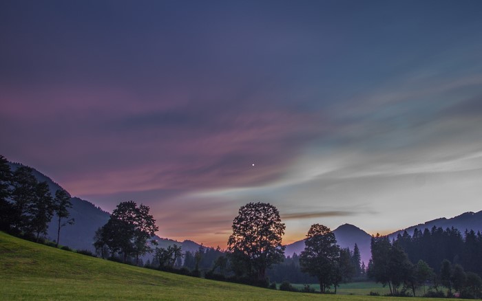 Mountains and trees at dusk in Kitzbuhel, Austria