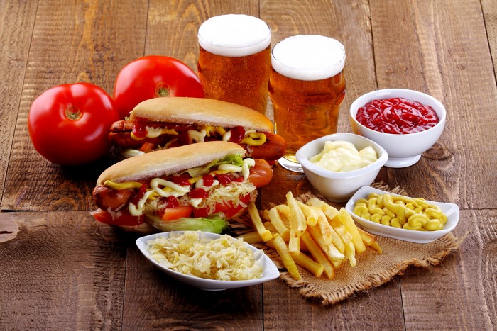 Hot dogs with french fries and beer