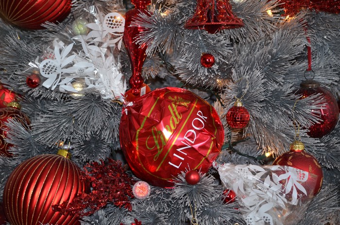 Christmas tree with red ornaments and Lindt chocolate