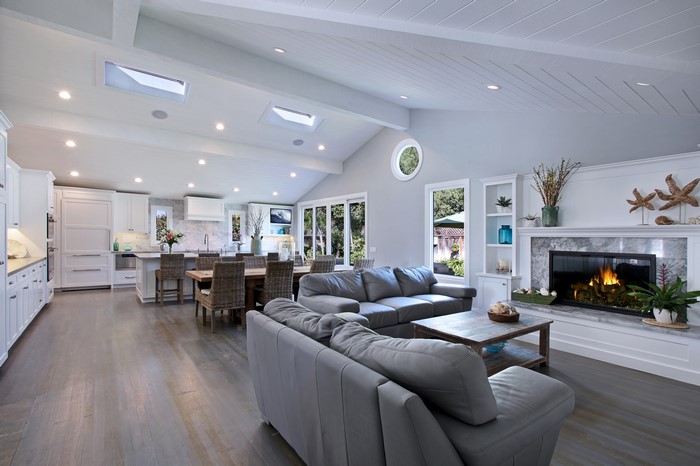 Living room with fireplace and kitchen