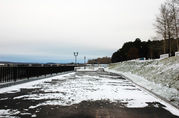 Snowy waterfront promenade in Ust-Kachka, Russia