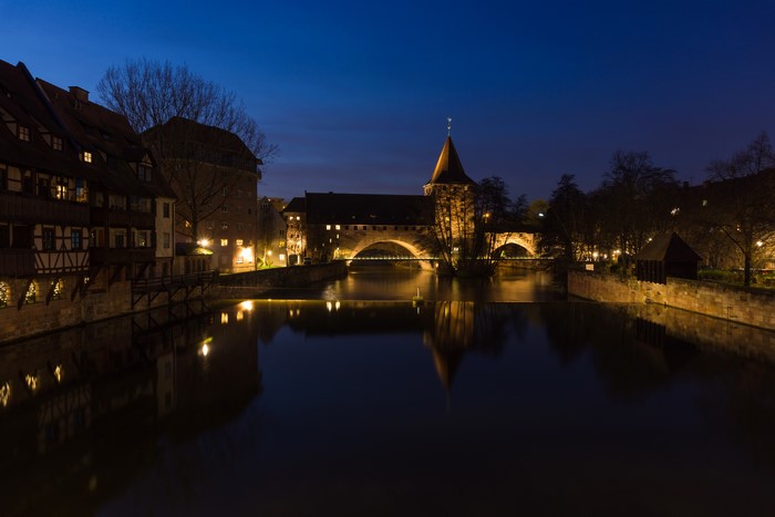 Nuremberg Riverfront at Night with Bridges and Houses
