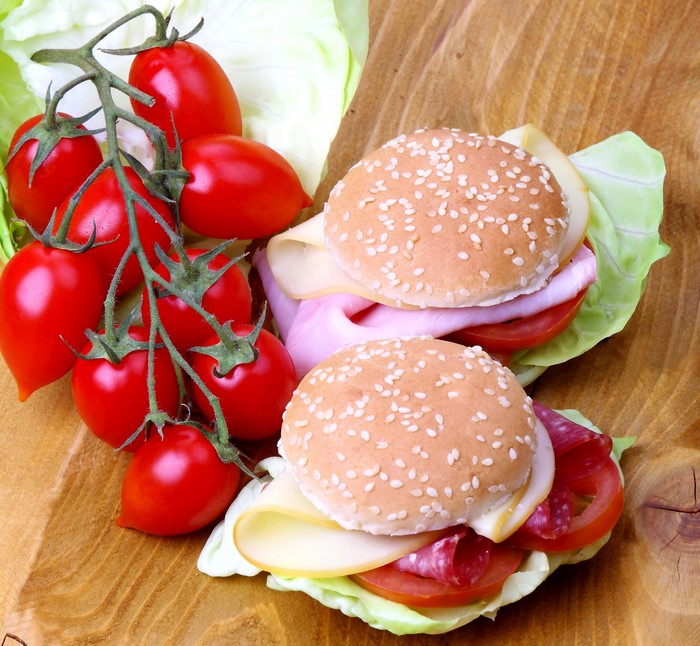 Two mini sandwiches with tomatoes and lettuce
