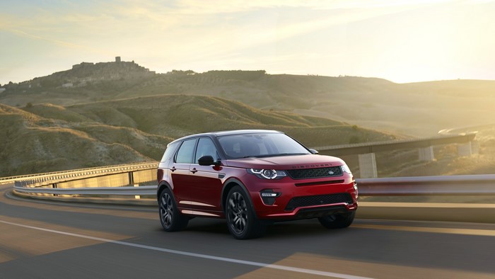 Red Land Rover Discovery Sport on a Road