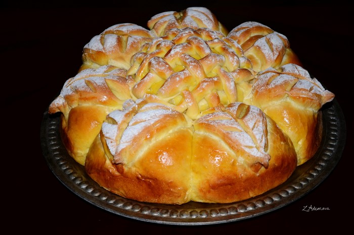 Decorative braided bread dusted with powdered sugar