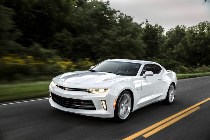 White 2016 Chevrolet Camaro driving on a road