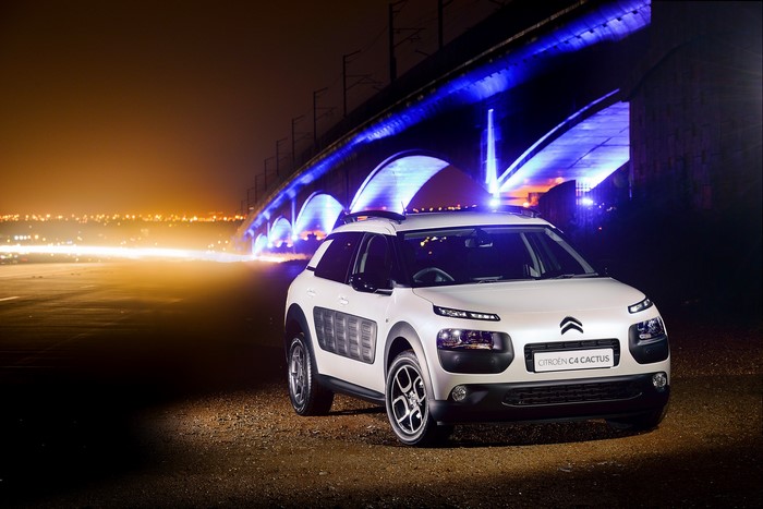 White Citroen C4 Cactus parked at night under a bridge