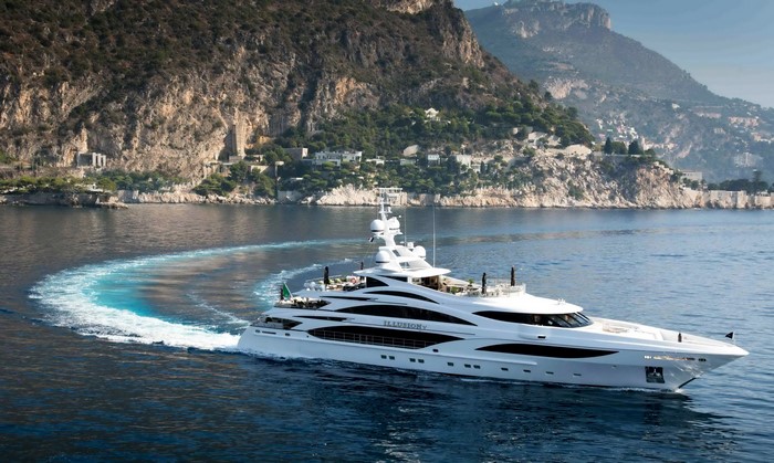 Luxury yacht sailing near mountains
