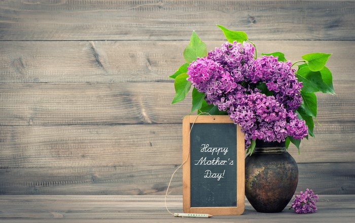 Mother's Day Lilac Bouquet in Vase on Wooden Background