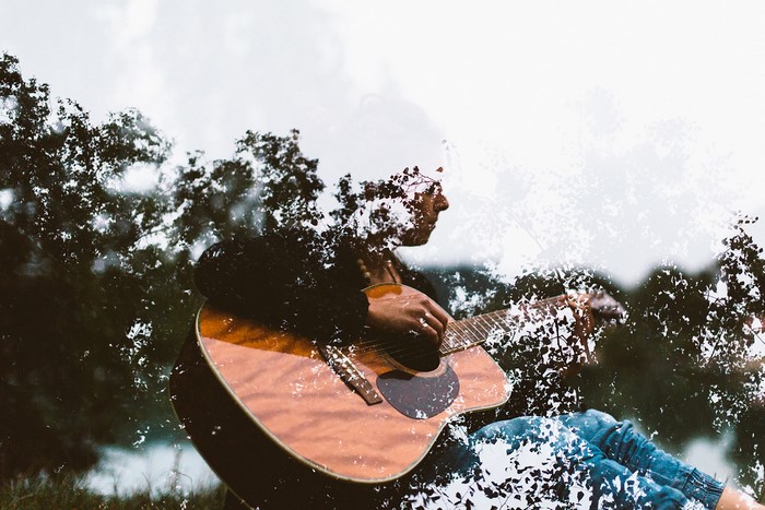 Man playing guitar outdoors