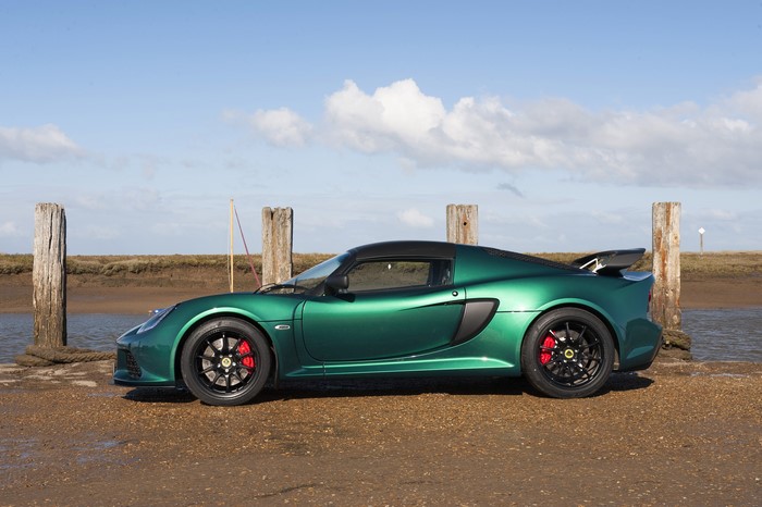Green Lotus Exige Sport 350 parked by water