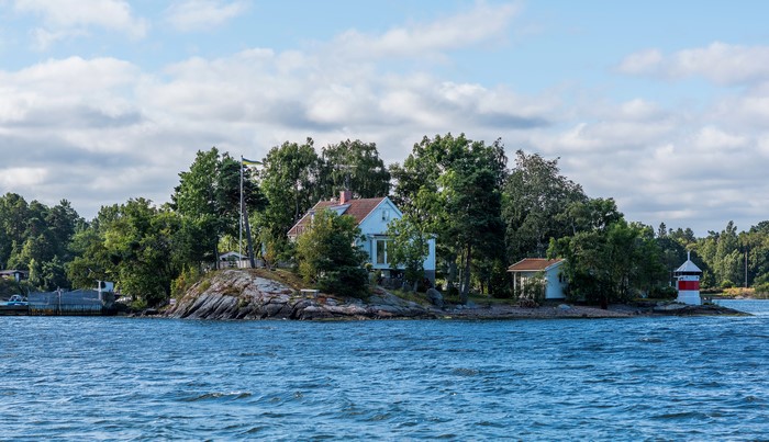 Island houses and lighthouse in Sweden