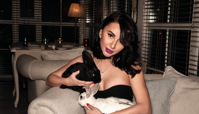 Brunette girl with rabbits