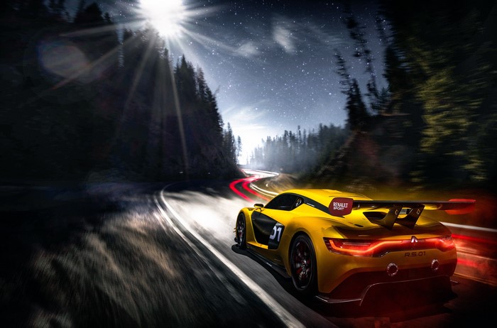 Yellow Renault Sport RS.01 racing on a forest road at night