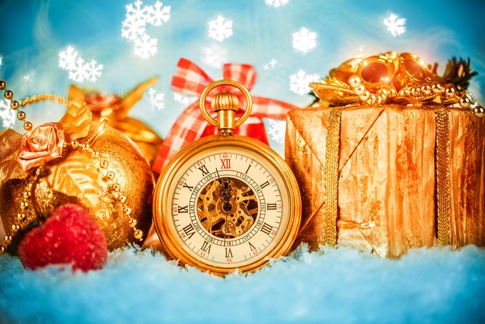 Pocket watch with Christmas gifts and snowflakes