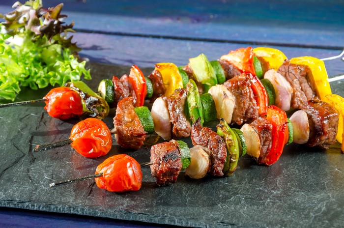 Meat and Vegetable Skewers on a Slate Plate