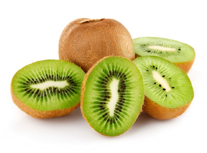 Whole and sliced kiwis on a white background