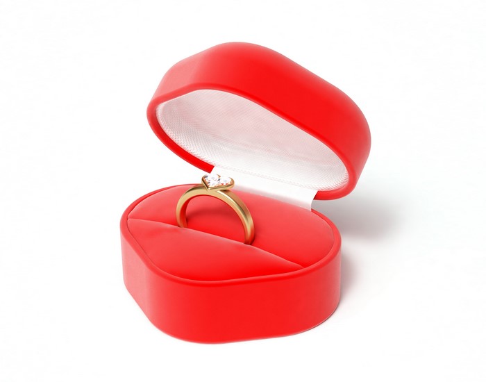 Diamond ring in a red heart-shaped box
