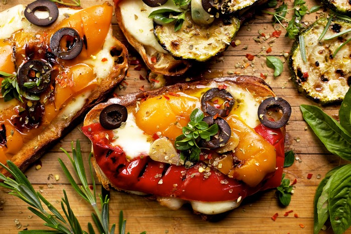 Open-faced sandwiches with vegetables and cheese