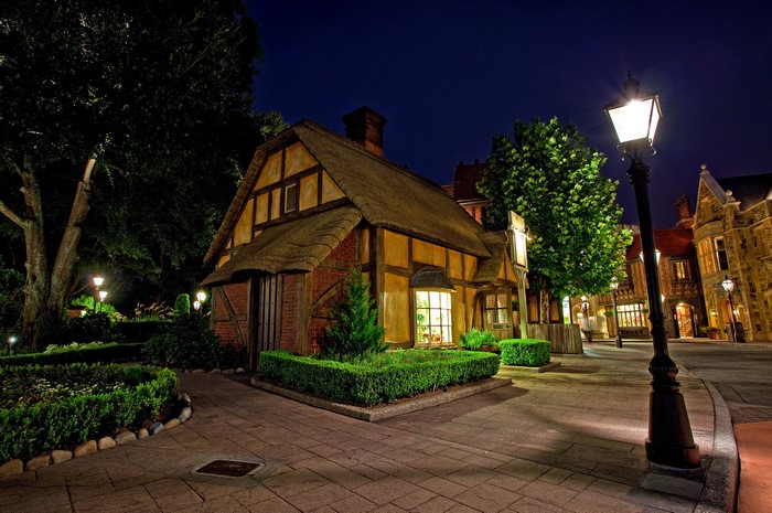 Tudor-style house at night with street lights in Disneyland