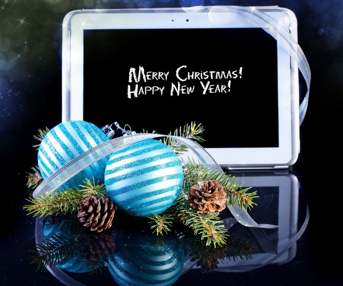 Christmas tablet with ornaments and pine cones