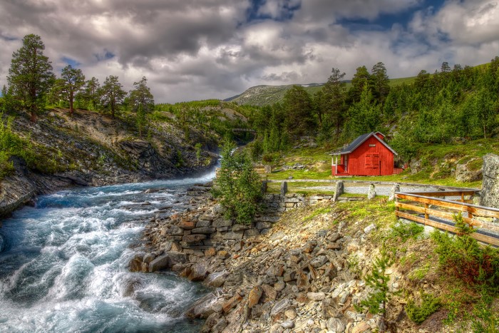 Red house by a river in Norway