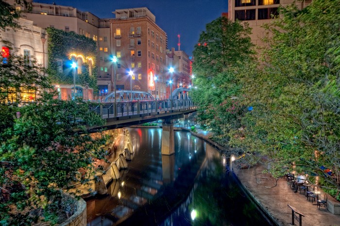 San Antonio Riverwalk at night with bridge and lights