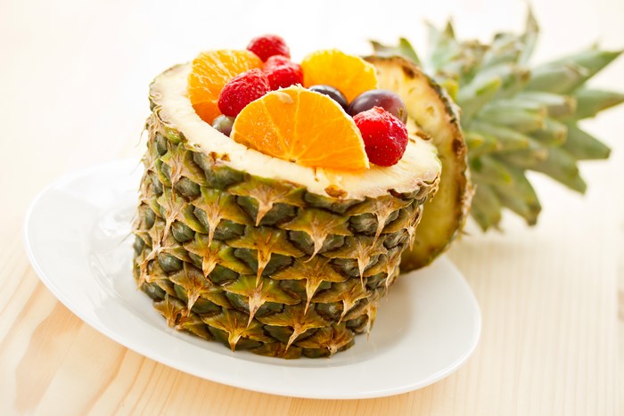 Fruit salad served in a pineapple bowl