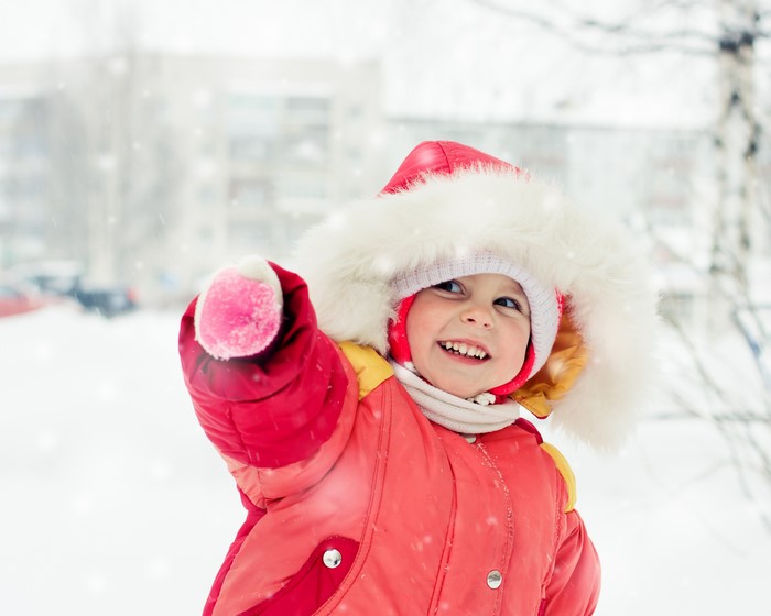Little girl in winter jacket smiling