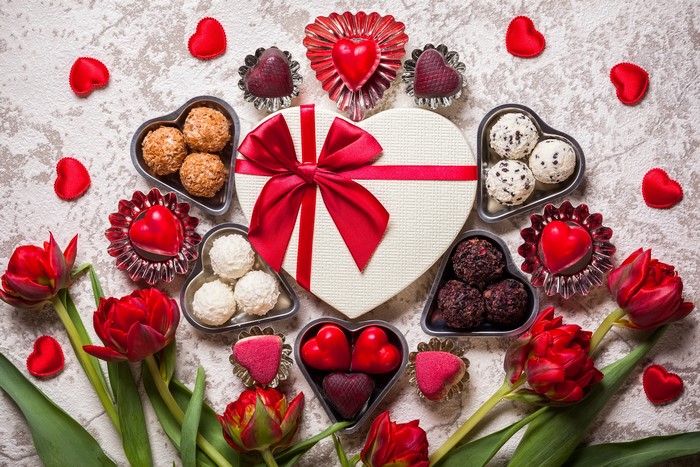 Valentine's Day heart-shaped gift box with chocolates and tulips