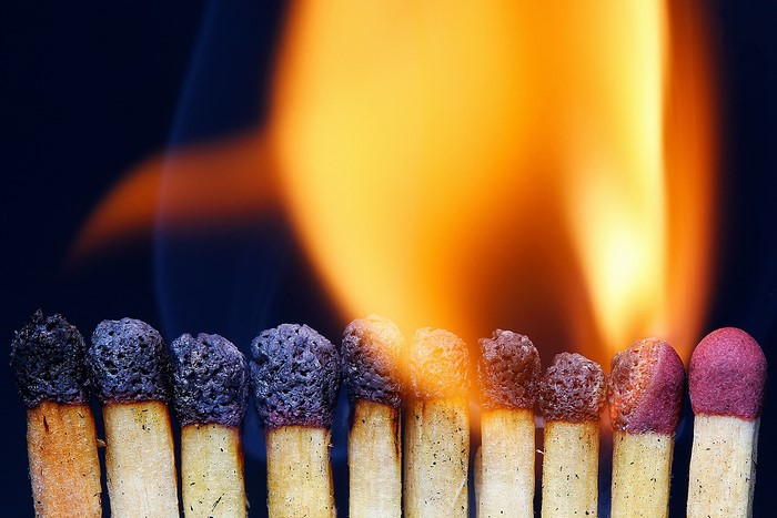 Burning matches in a row with flames