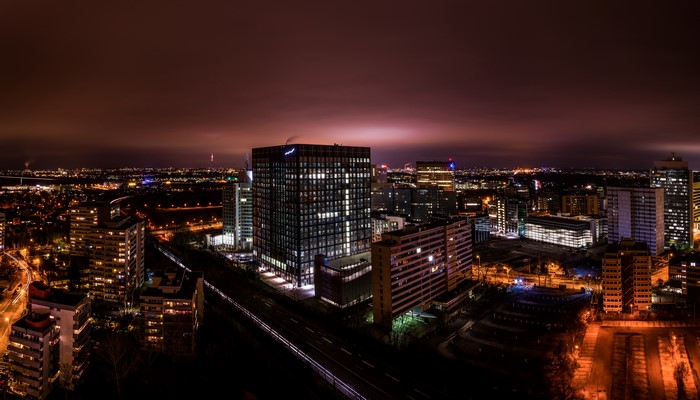 Night view of Eschborn, Germany with illuminated buildings and roads