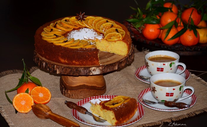 Orange cake with coffee and tangerines