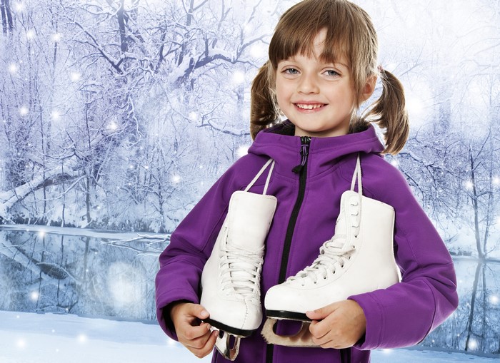 Girl with Ice Skates in Winter Forest