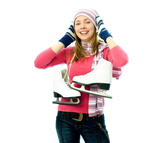 Woman in Winter Hat Holding Ice Skates