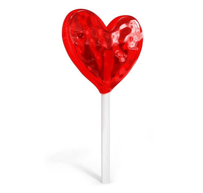 Red heart-shaped lollipop on a white stick