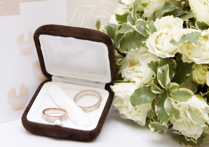 Wedding Rings in a Box with White Roses