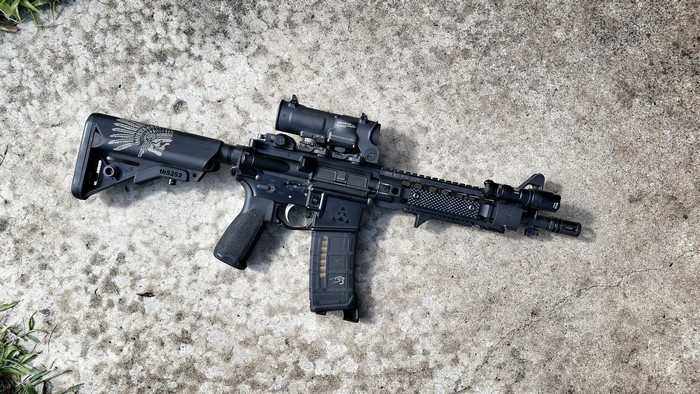 AR-15 style rifle with optic and accessories