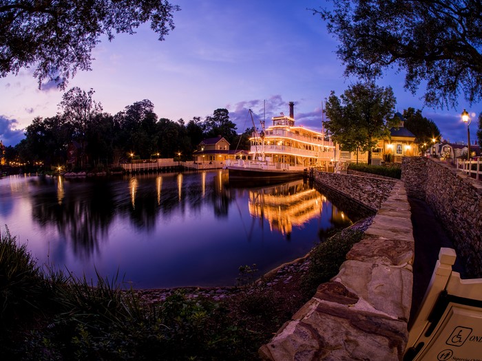 Steamboat on a river at dusk in Disneyland