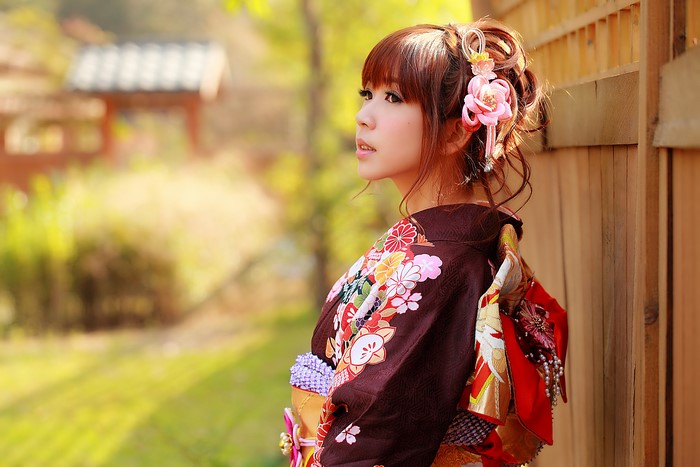 Asian woman in kimono with flowers in hair