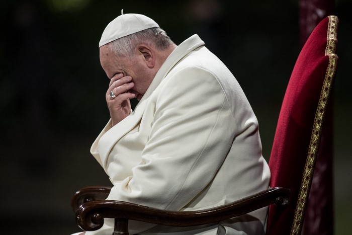 Pope Francis sitting on a chair