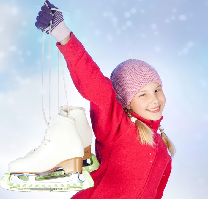 Girl holding ice skates
