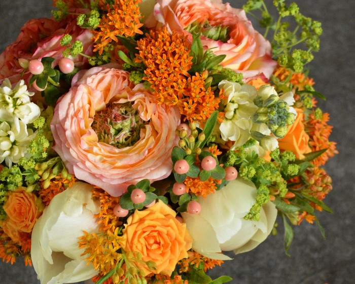 Peach and orange roses and tulips bouquet